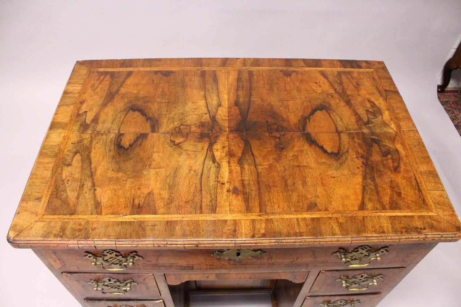 AN 18TH CENTURY WALNUT KNEEHOLE DESK, with quarter veneered top, one frieze drawer, a central - Image 2 of 17