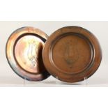 A PAIR OF NEWLYN COPPER CIRCULAR DISHES. 10.5ins diameter.