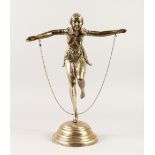 A LARGE ART DECO SILVERED DANCER on one leg, on a circular stepped base. 20ins high.