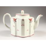 A NEWHALL OVAL SHAPED TEAPOT AND COVER, sprigged with flowers, No. N21.