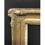 20th Century English School. A Gilt Composition Frame, with Swept Centres and Corners, and a Hessian