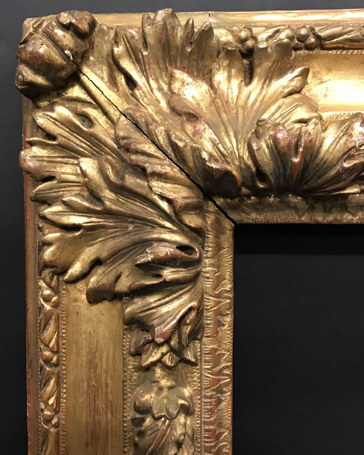 18th Century Italian School. A Carved Giltwood Frame, with Swept Corners, 24.5" x 24" (rebate).