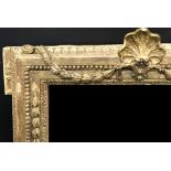 19th Century French School. A Carved Giltwood Frame, with Central Shell design, and Inset Mirror,