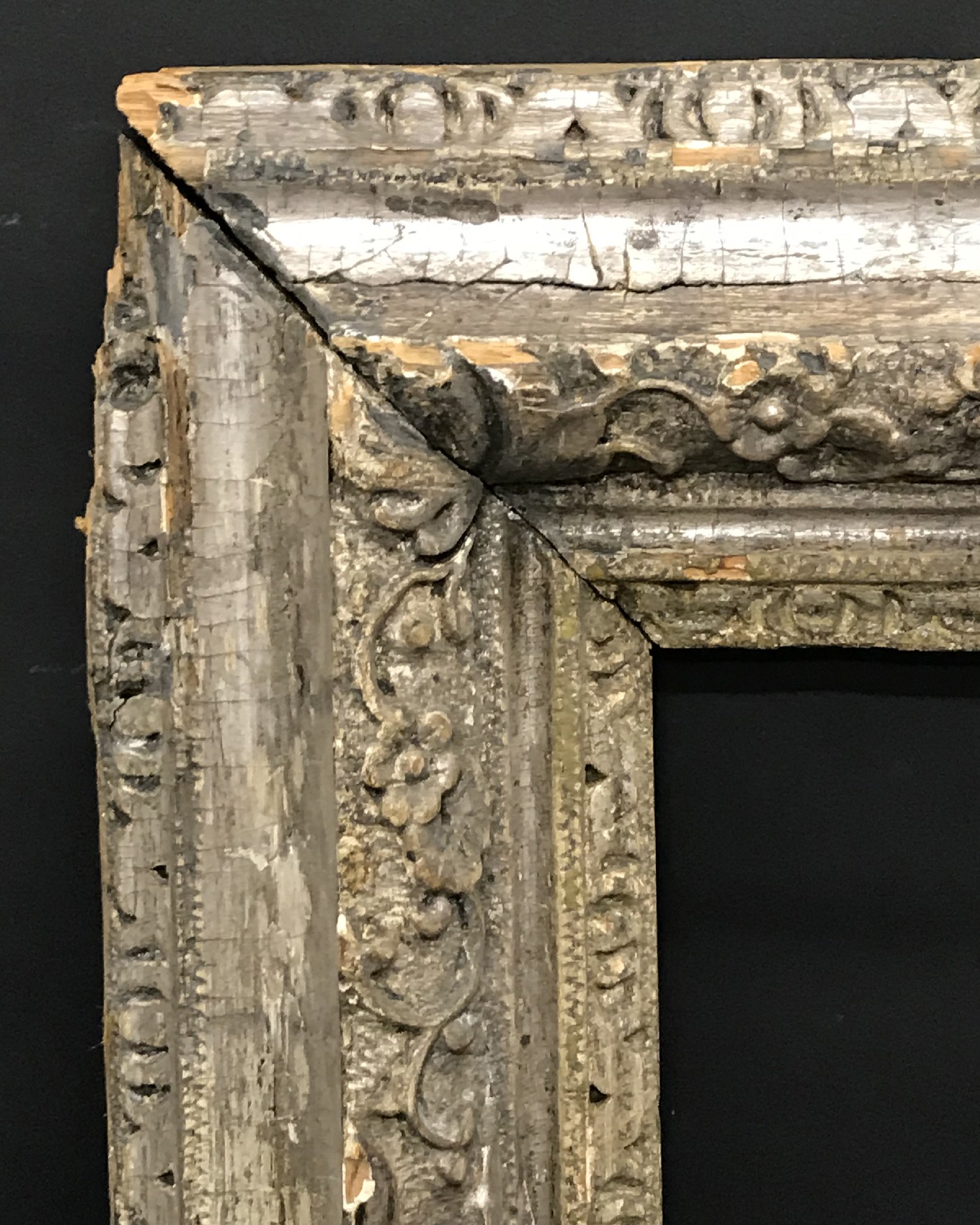 18th Century English School. A Carved Wood Silvered Frame, with Lely Panels, 27.25" x 22.75" (