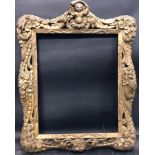 18th Century English School. An Ornate Gilt Carved Wood Frame, with a Central Cherub, 19.5" x 15.