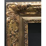 Early 20th Century Continental School. A Gilt Composition Frame, with Swept Centres and Corners,