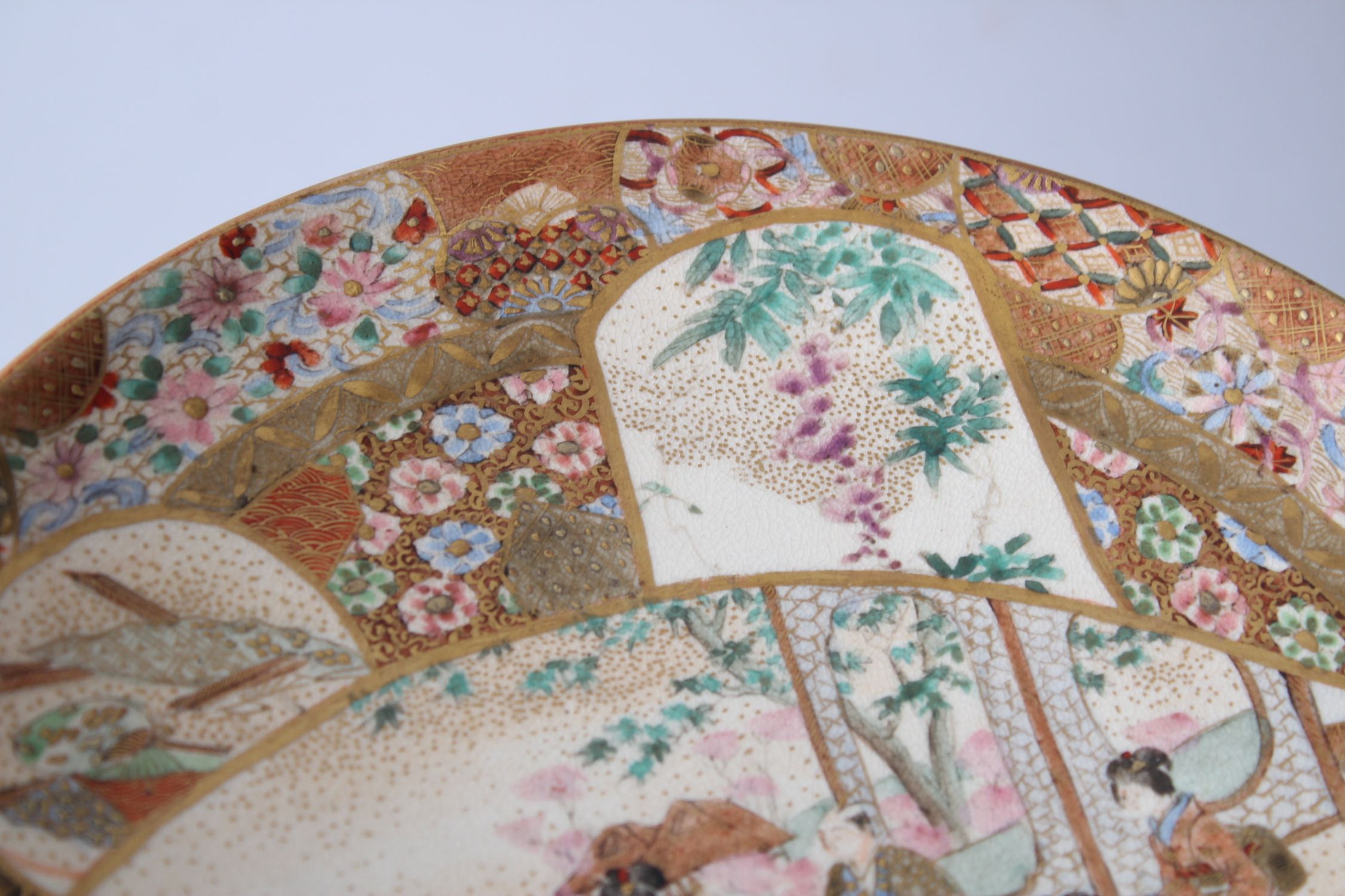 A GOOD JAPANESE MEIJI PERIOD SATSUMA PORCELAIN PLATE, decorated with panels of figures by - Image 3 of 5