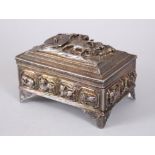 A GOOD 19TH CENTURY BURMESE SOLID SILVER CASKET, decorated in high relief to depict figures in a