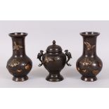 A GOOD GARNITURE OF JAPANESE BRONZE AND MIXED METAL, consisting of a pair of vases and a koro, all