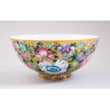 A CHINESE 'HUNDREDS OF FLOWER' FAMILLE ROSE PORCELAIN BOWL, the exterior profusely decorated with
