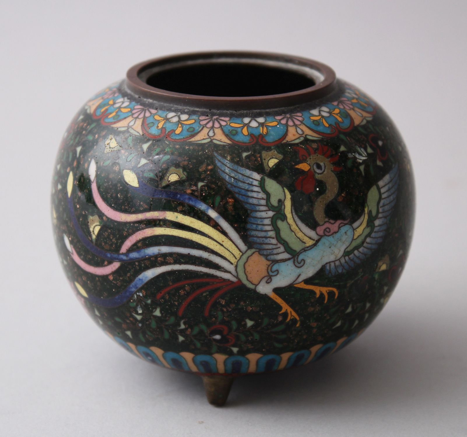 A JAPANESE MEIJI PERIOD CLOISONNE KORO, decorated with a gold dust ground surrounded with floral