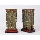 A PAIR OF CHINESE 20TH CENTURY BRONZE VASES & WOOD STANDS, the body of the vases decorated with