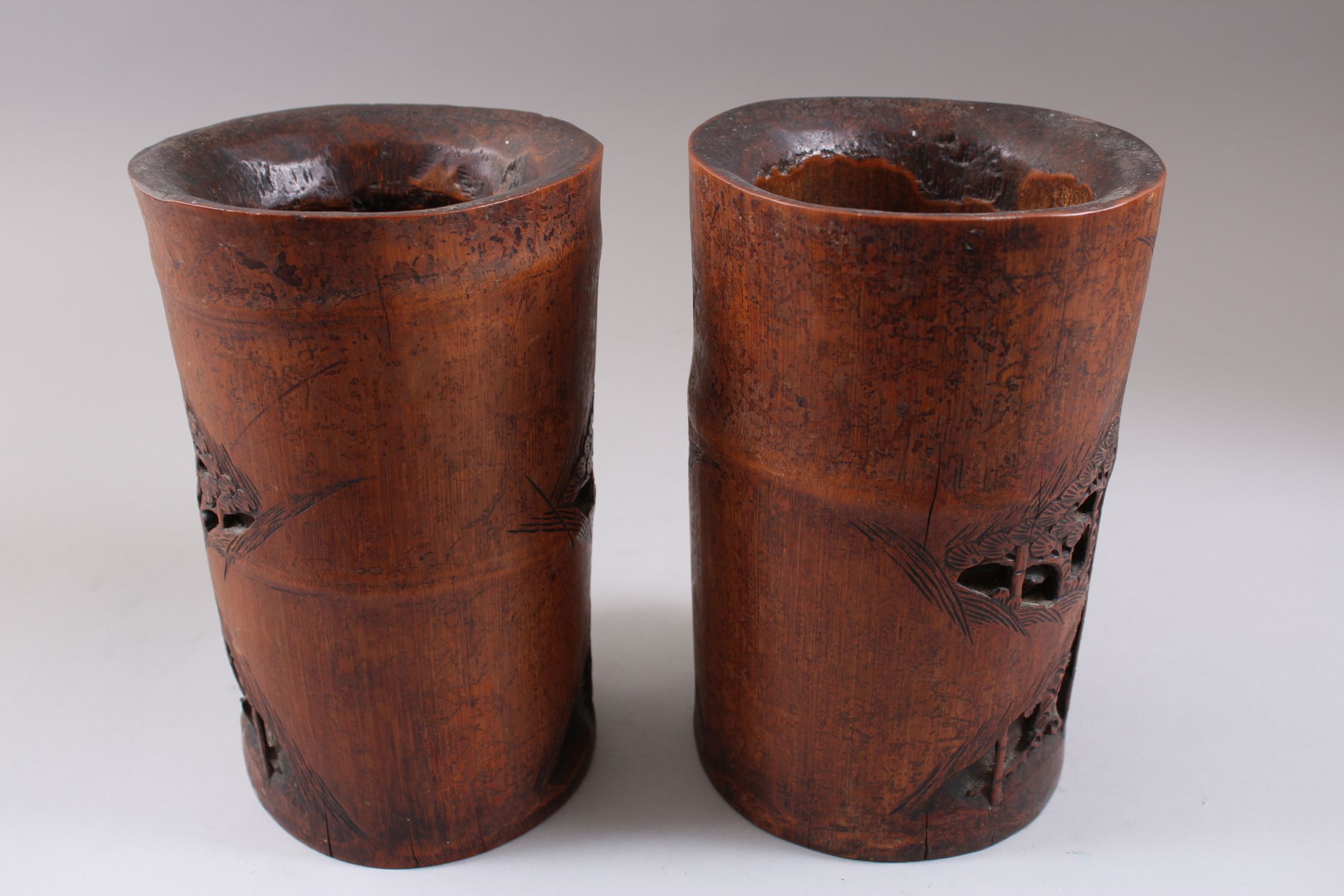 A PAIR OF CHINESE 19TH CENTURY BAMBOO CARVED BRUSH POTS, carved deeply to depict scenes of figures - Image 2 of 3