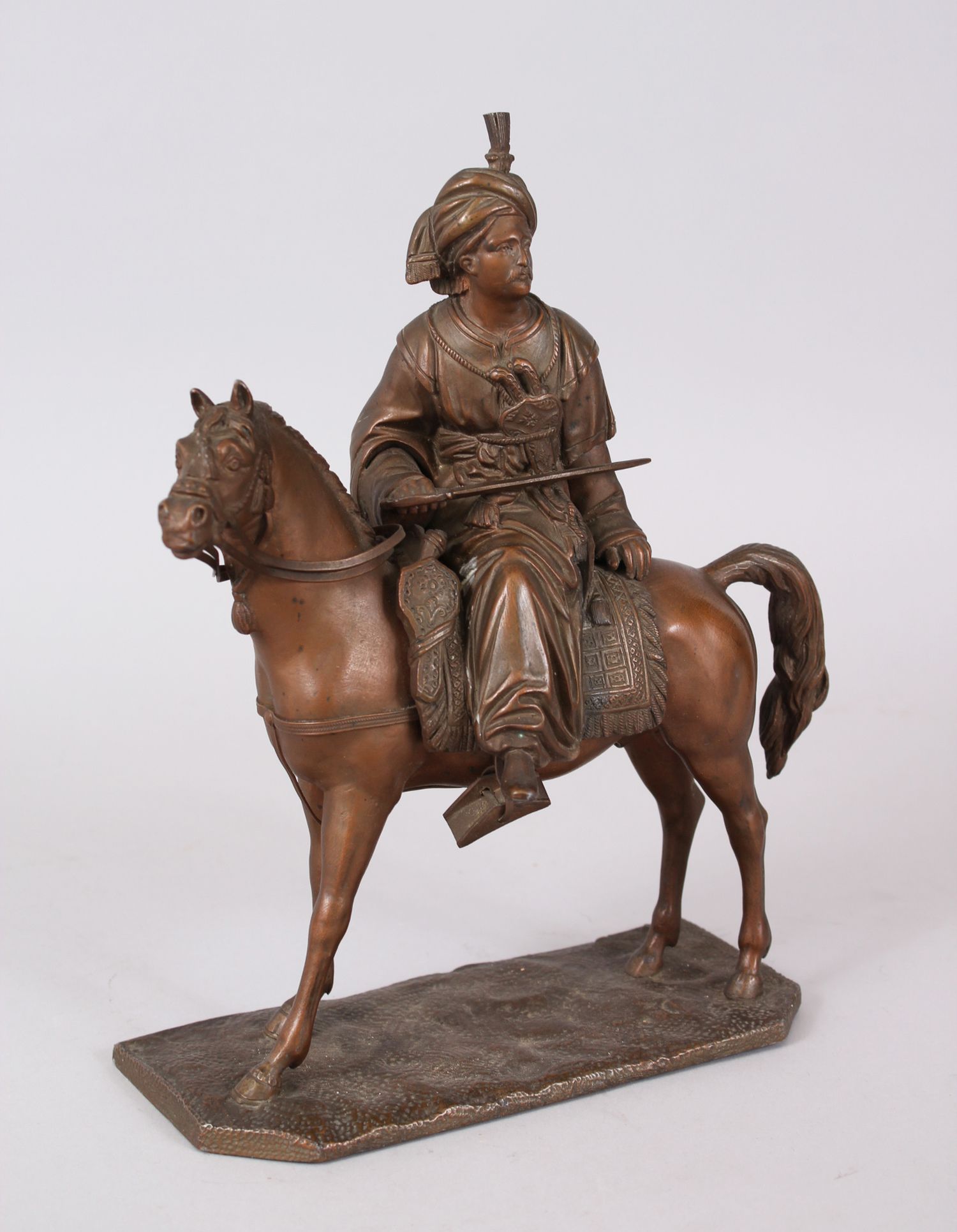 A GOOD BRONZE FIGURE OF A TURKISH MAN UPON HORSE, the figure seated sideways upon the horse