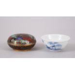 A CHINESE CLOISONNE CIRCULAR BOX AND COVER & A CHINESE BLUE AND WHITE PORCELAIN TEA BOWL, the