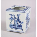 A 19TH CENTURY CHINESE BLUE & WHITE PORCELAIN TEAPOT HOLDER, decorated with our different scenes