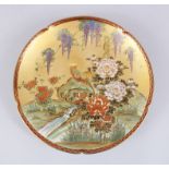 A JAPANESE MEIJI PERIOD SATSUMA PORCELAIN PLATE, decorated with scenes of hanging wisteria over