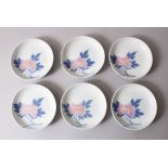 A SET OF SIX JAPANESE LATE MEIJI PORCELAIN DISHES, each decorated with floral scenes, the base