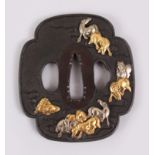 A GOOD JAPANESE EDO PERIOD SHAKUDO ONLAID TSUBA OF HORSES, the mokko form tusba with on laid mixed