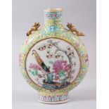 A 19TH CENTURY CHINESE FAMILLE ROSE PORCELAIN MOON FLASK, decorated with scenes of immortals