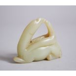 A 19TH CENTURY CHINESE CARVED PALE JADE PENDANT OF A MYTHICAL ANIMAL, century, 4.4cm x 5.4cm