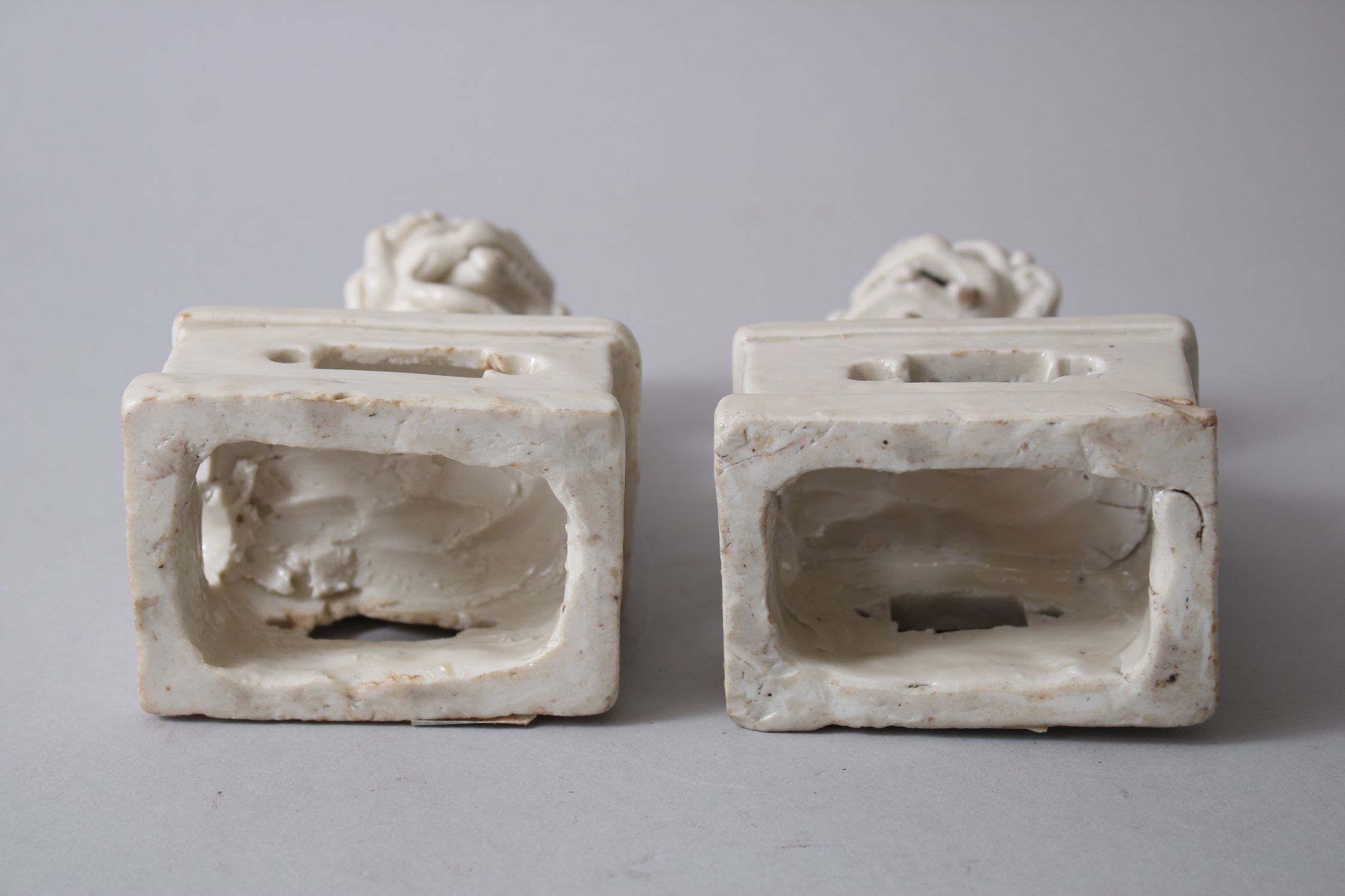 PAIR OF 19TH CENTURY CHINESE CHINE DE BLANC / DEHUA LION DOG FIGURES, both seated upon pierced - Image 4 of 4