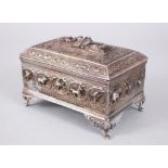 A GOOD 19TH CENTURY BURMESE SOLID SILVER CASKET, decorated in high relief to depict figures