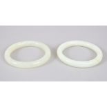 A GOOD PAIR OF CHINESE JADE BANGLES, both 7.7cm outer diameter x inside diameter of 5.7cm