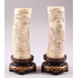 A GOOD PAIR OF JAPANESE MEIJI PERIOD CARVED IVORY LUCKY GOD TUSK VASES ON GOLD LACQUER STANDS,