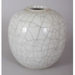 A CHINESE BULBOUS CRACKLE GLAZE GINGER JAR, 16.6cm high x 17cm wide.