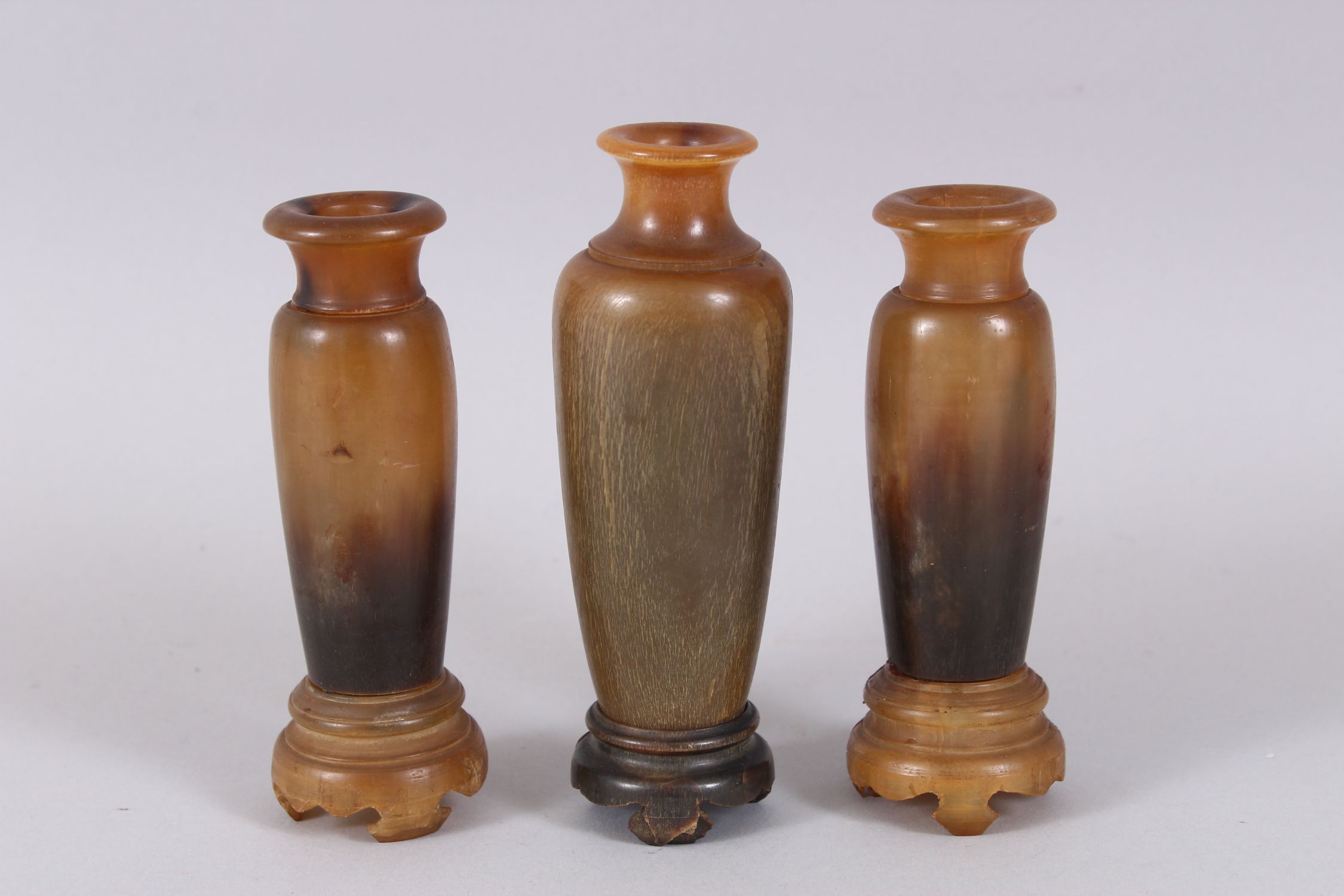 A GOOD GARNITURE OF THREE RHINO HORN TURNED VASES ON STANDS, 12cm x 11cm high. Weight 234gms. - Image 2 of 6