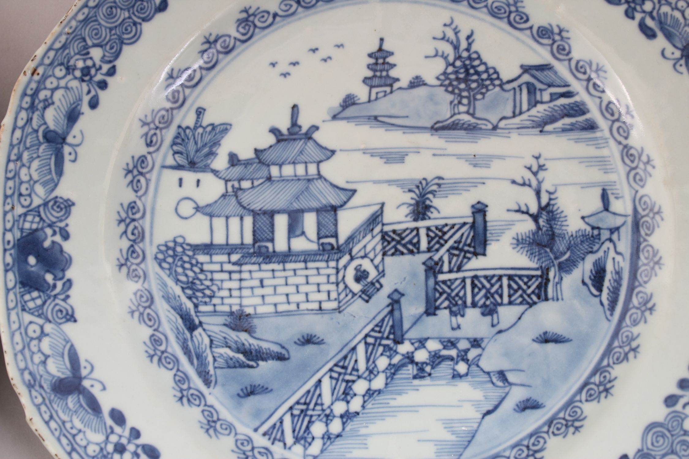 A PAIR OF 19TH CENTURY CHINESE EXPORT BLUE & WHITE PLATES, decorated with landscape scenes, 22.5cm - Image 3 of 4