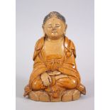 A GOOD CHINESE SANCAI STYLE TERRACOTTA POTTERY FIGURE OF A SEATED BUDDHA, with a brown glaze and sat