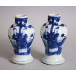 A GOOD PAIR OF 19TH CENTURY CHINESE BLUE & WHITE BALUSTER VASES, decorated with scenes of figures