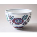 A 19TH CENTURY CHINESE DOCAI PORCELAIN TEA CUP, decorated interior with blue and white floral
