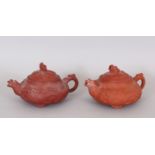 A GOOD PAIR OF 17TH / 18TH CENTURY MOULDED ZISHA YIXING POTTERY TEAPOTS & COVERS, circa 1690, the