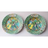 A PAIR OF 19TH CENTURY JAPANESE PORCELAIN SAUCER DISHES, decorated with scenes of figures seated,