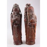 A PAIR OF CHINESE CARVED BAMBOO FIGURES OF SHOU LAO & GUANYIN, both measuring 57cm high x approx