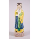 A 19TH CENTURY CHINESE PORCELAIN IMMORTAL FIGURE, 19.8cm high x 6.2cm wide.