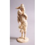 A GOOD JAPANESE MEIJI PERIOD TOKYO SCHOOL CARVED IVORY OKIMONO OF FATHER AND SON, the boy upon the