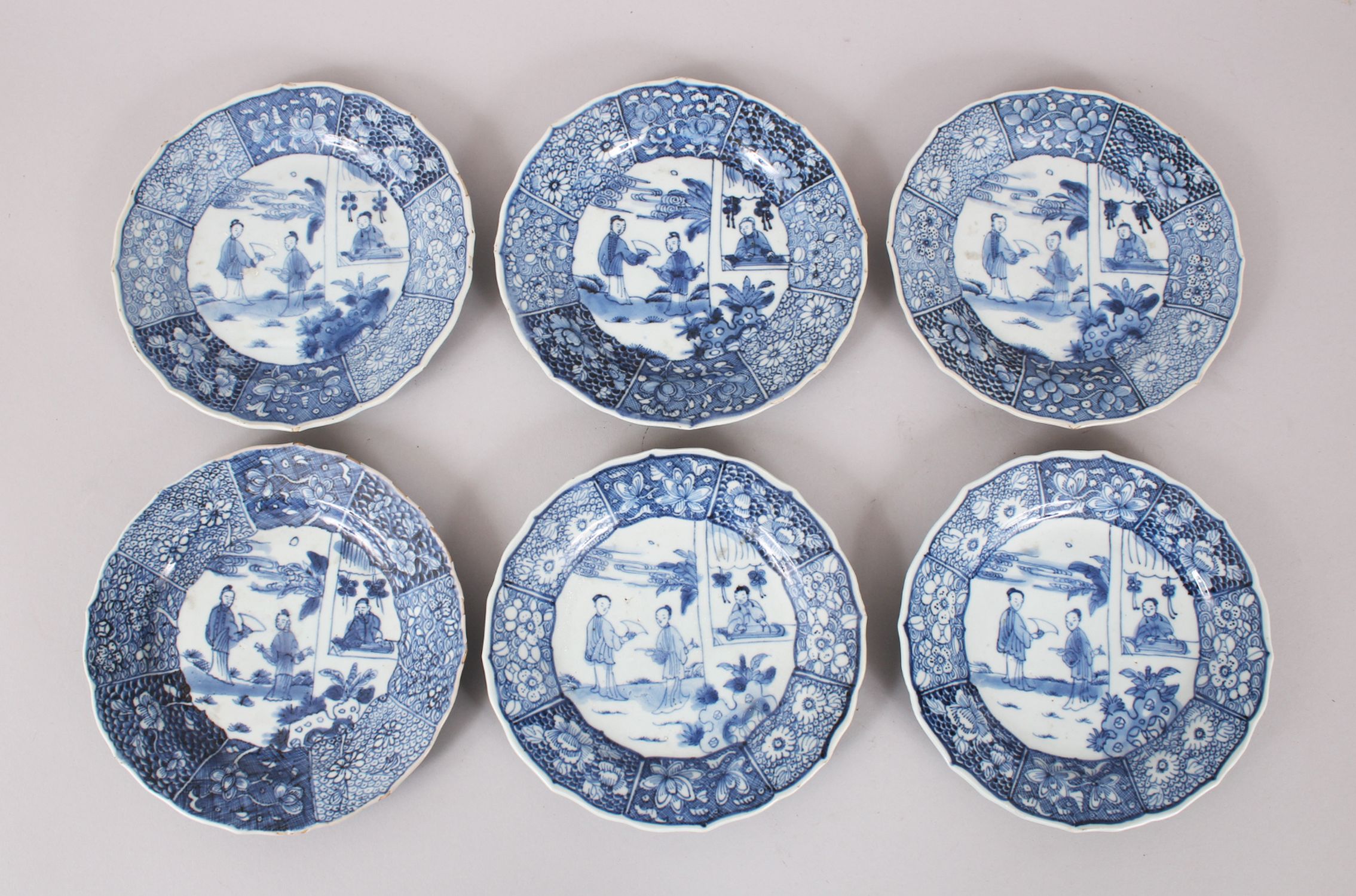 A SET OF SIX 19TH CENTURY CHINESE BLUE & WHITE SAUCERS, each decorated with scenes of figures within