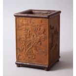 AN EARLY 20TH CENTURY CHINESE BAMBOO SQUARE FORM BRUSH POT, each side carved with different scenes
