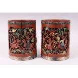 AN UNSUSUAL PAIR OF CHINESE BAMBOO PAINTED BRUSH POTS, carved with scenes of phoenix birds, foo dogs