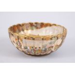 A JAPANESE MEIJI PERIOD SATSUMA PORCELIAN SCALLOPED DISH, the interior finely decorated with