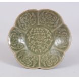 A 19TH CENTURY CHINESE MING STYLE LONGQUAN WEAR LOBED PORCELAIN SAUCER, with leaf decoration