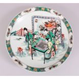 A CHINESE FAMILLE VERTE PORCELAIN DISH, decorated with scenes of five figures exterior playing a