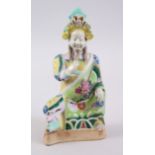A 19TH CENTURY CHINESE FAMILLE ROSE PORCELAIN FIGURE OF GUANDI, sat in traditional robes with his