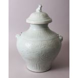 A LARGE CHINESE CELADON LONGQUAN JAR & COVER, decorated with deer, formal scrolls and flora,