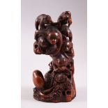 A GOOD JAPANESE MEIJI PERIOD CARVED HARDWOOD MONKEY GROUP OKIMONO, carved in great detail to