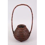 A FINE JAPANESE MEIJI PERIOD WOVEN BAMBOO IKEBANA BASKET ARTIST SIGNED, the basket with a woven